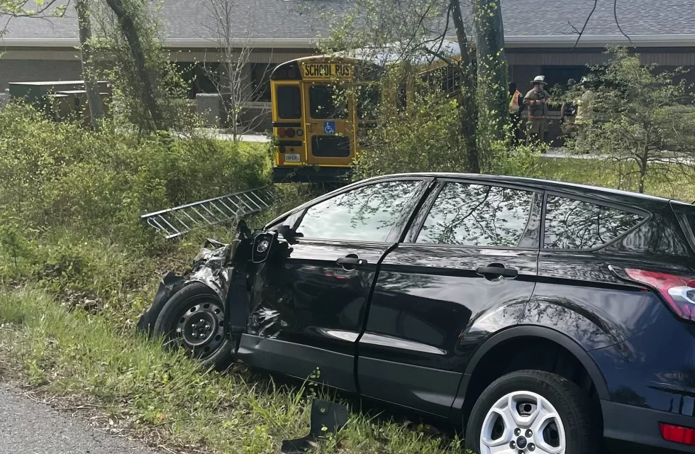 Virginia school bus hits DMV building, injures driver and two students, officials say